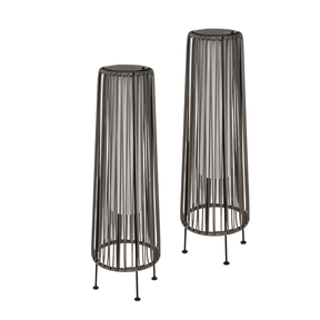 Two black wire mesh plant stands on a white background