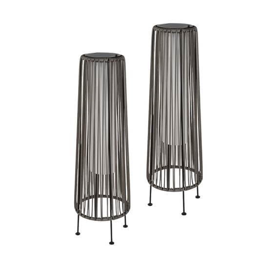 Two black wire mesh plant stands on a white background