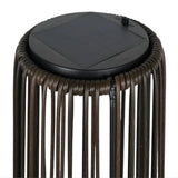 Solar-powered outdoor lamp with rattan design and black solar panel on a white background.