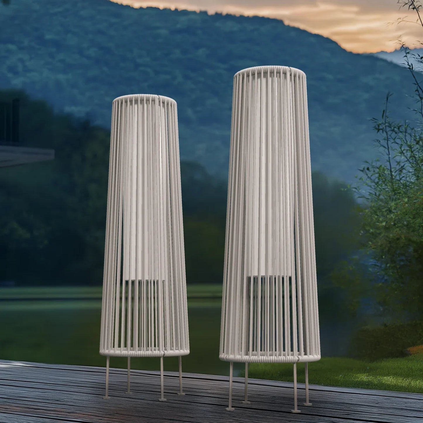 Two tall cylindrical garden丈夫s on a wooden deck with a scenic background