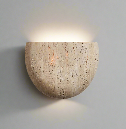 Natural stone wall sconce in beige finish on white background 