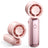 Pink handheld fan with a compact design on a white background