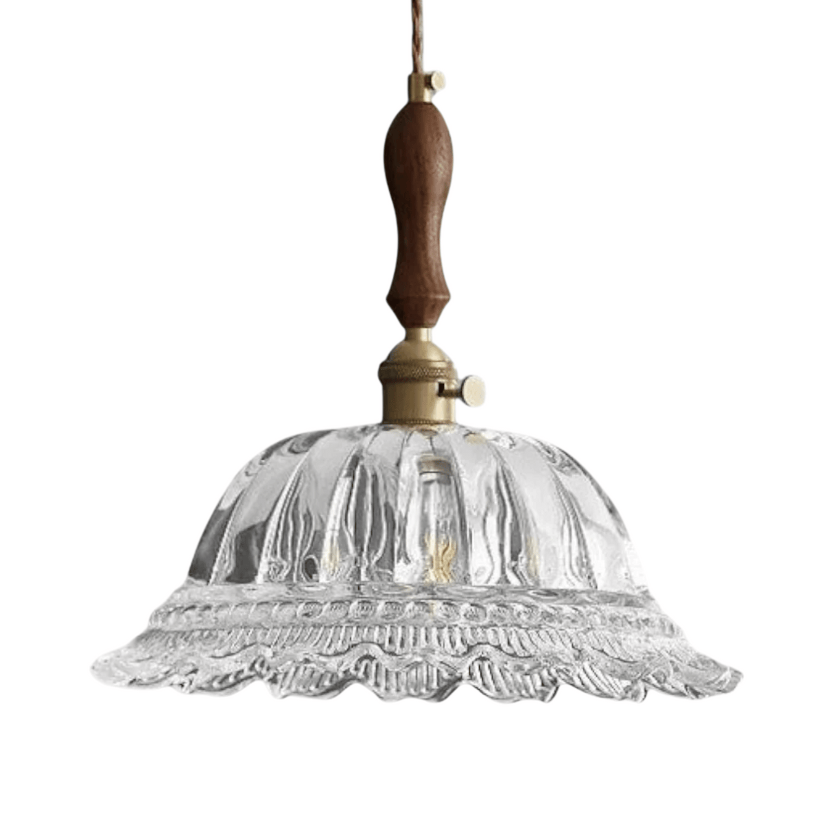 Clear glass pendant light with wooden and brass accents on a white background