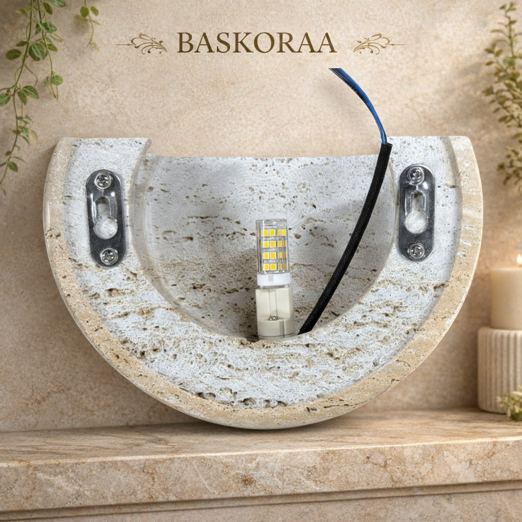 Decorative travertine stone wall light fixture with LED bulb on a neutral background, featuring the brand 'Baskoraa'.