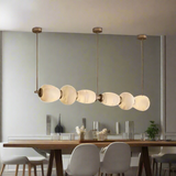 Modern pendant light with glass shades on a white background