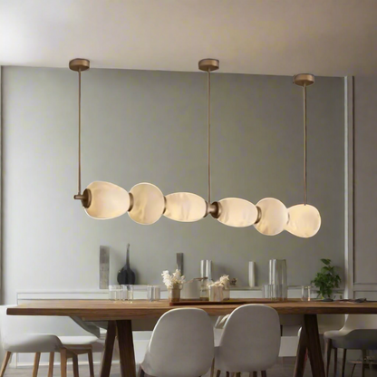Modern pendant light with glass shades on a white background