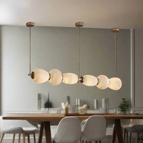 Modern pendant light with glass shades on a white background