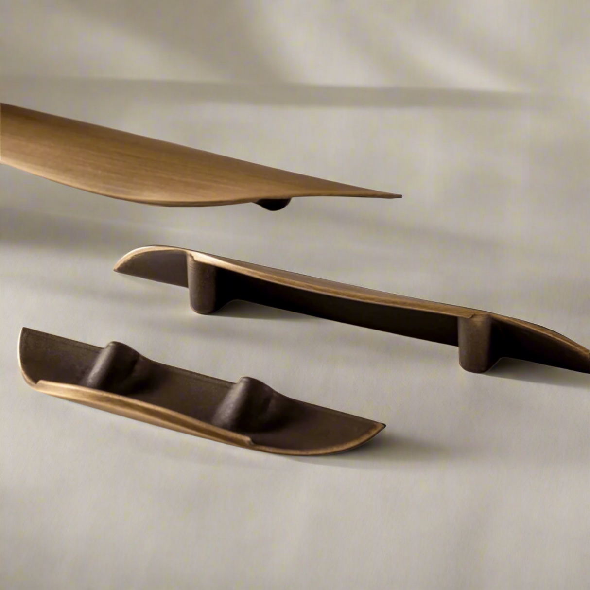 Set of bronze-colored shelves on a beige background