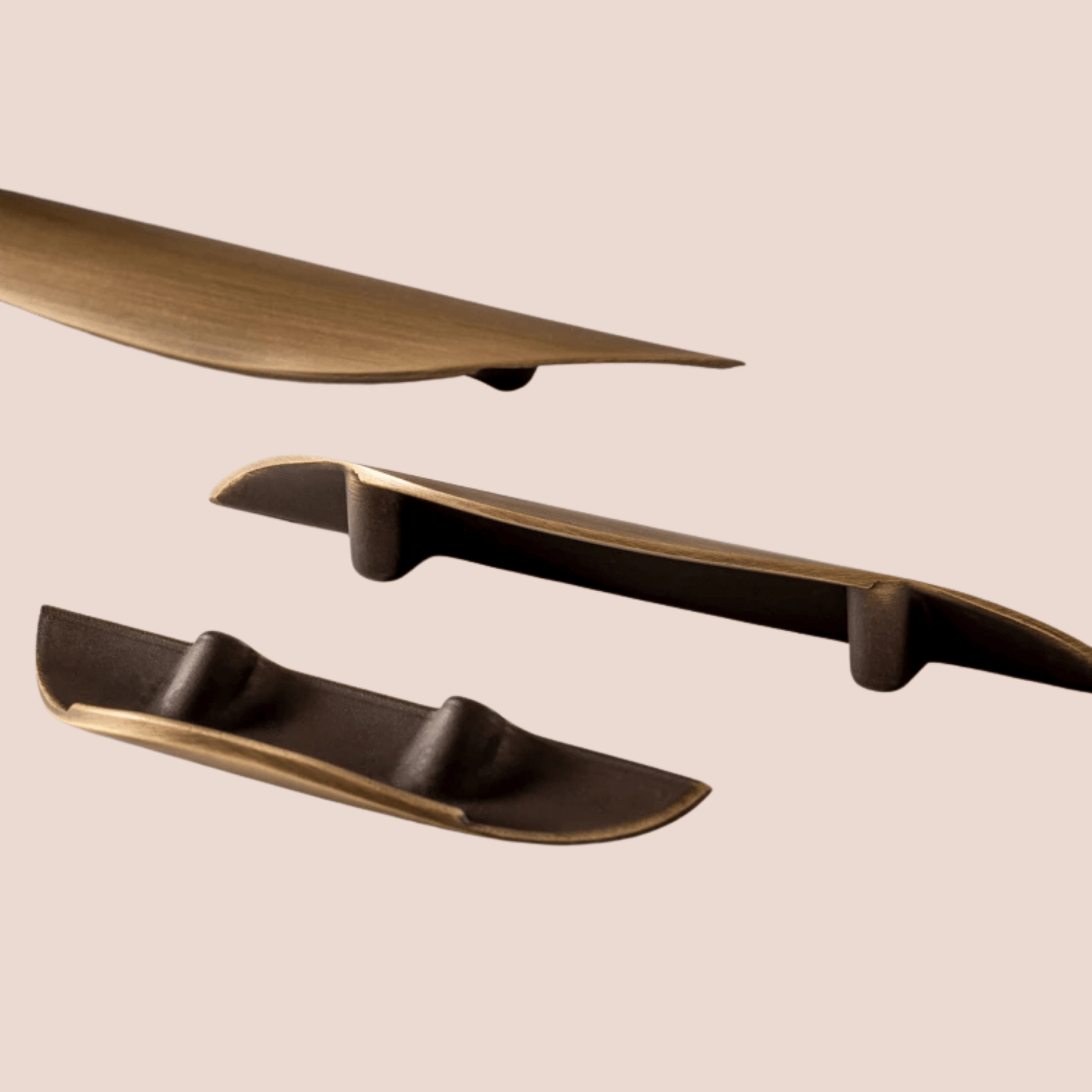 Set of bronze-colored shelves on a beige background