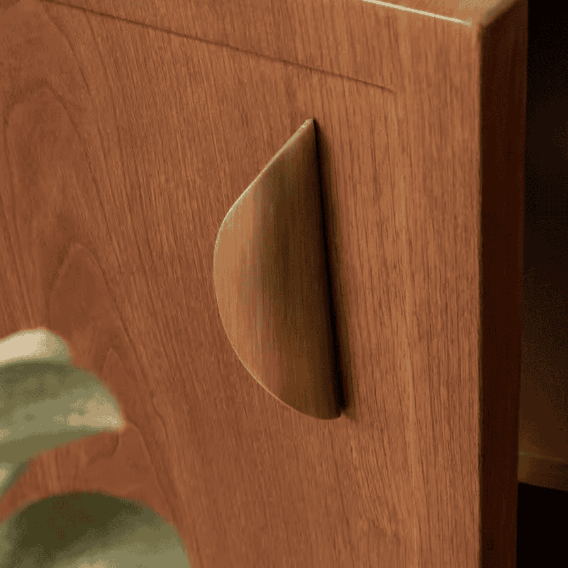 Close-up of a wooden drawer with a metal handle
