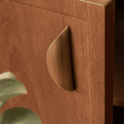 Close-up of a wooden drawer with a metal handle