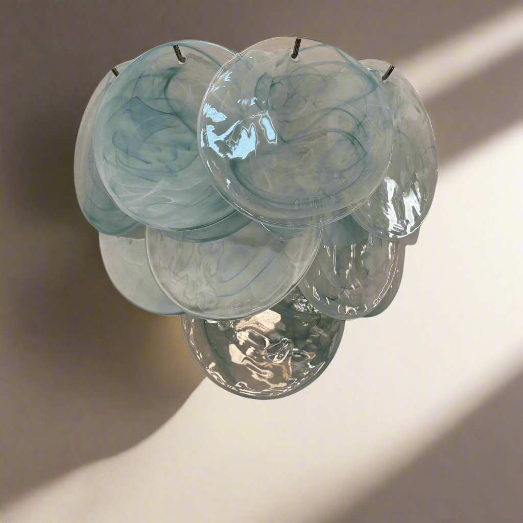 Set of five marbled effect candles on a white background