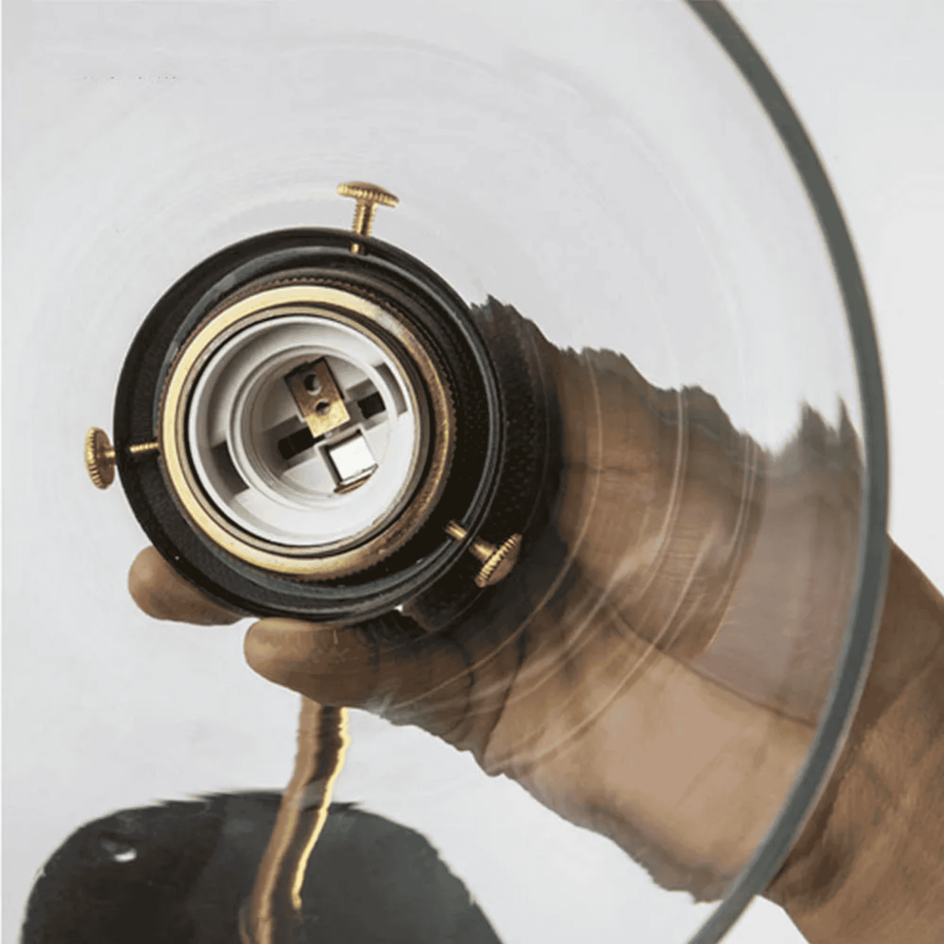Close-up of Retro Glass Wall Sconce socket and brass detailing. Easy installation design for modern indoor lighting fixtures.