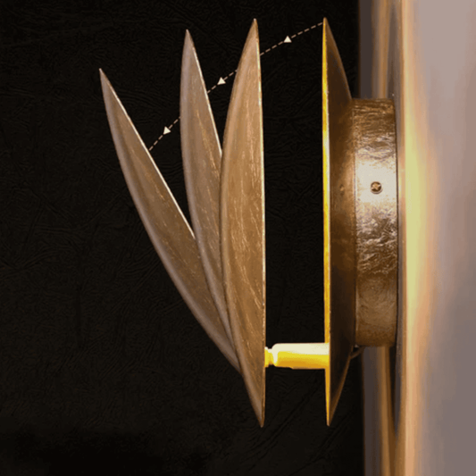 Side view of rotatable Moon Eclipse LED Wall Light showing adjustable bronze alloy plates. Modern lighting fixture for home interiors.