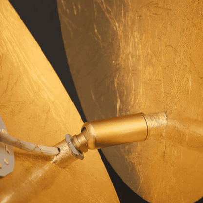 Detailed view of gold copper hinge in Moon Eclipse LED Wall Light. Durable bronze alloy construction enhances modern lighting design.