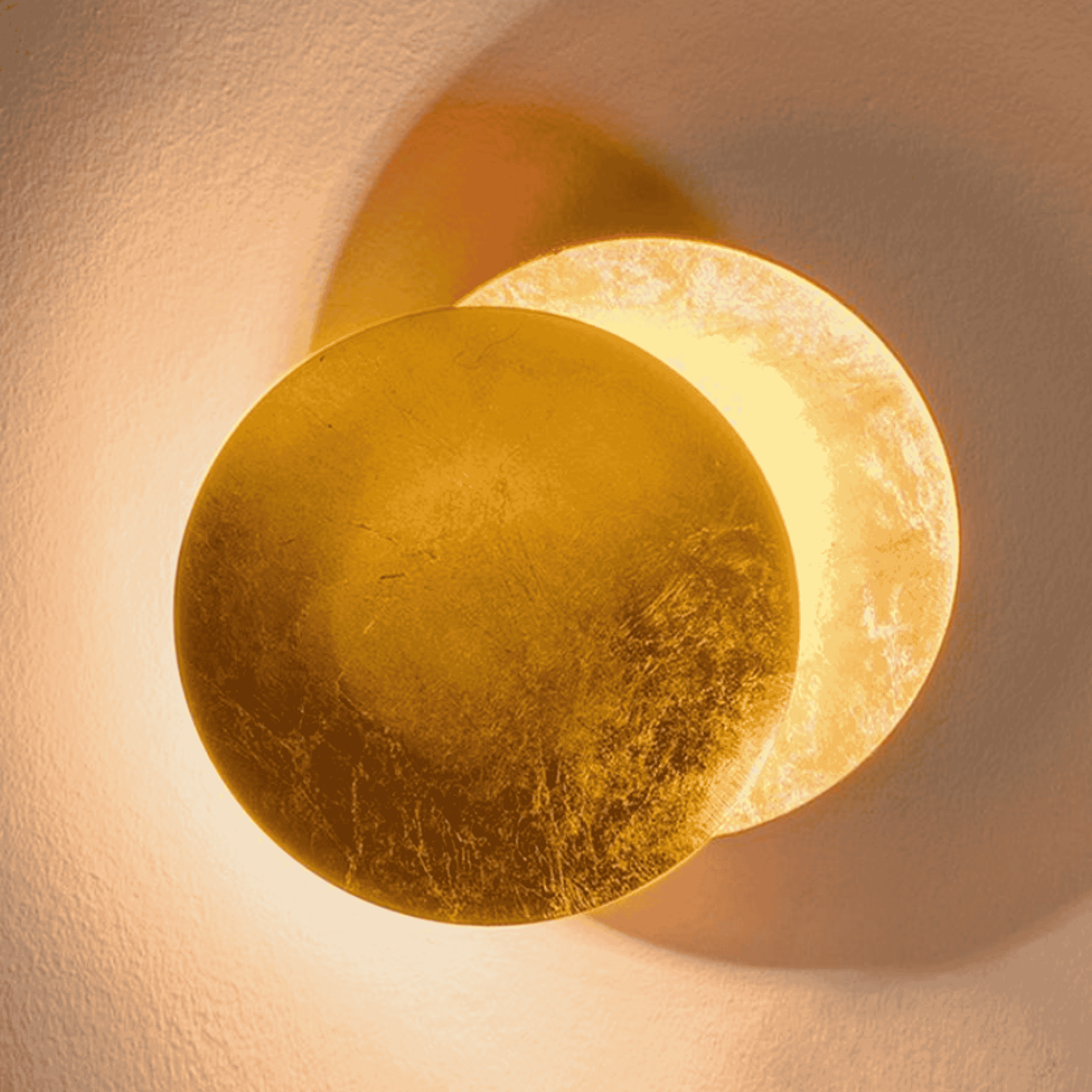 Fully illuminated Moon Eclipse LED Wall Light with golden glow. Stylish round design for modern home lighting and decor.