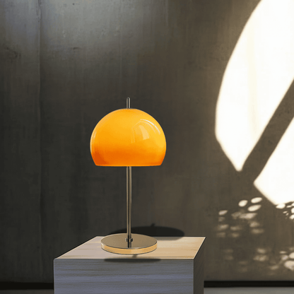 BauGlow Retro Mushroom Lamp - Stylish and Functional table lamp displayed on a pedestal, showcasing its glossy amber shade and chrome base.