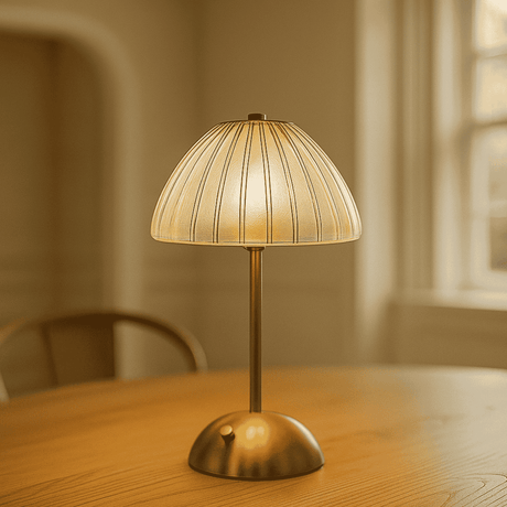 Small table lamp with a textured shade on a wooden surface.

