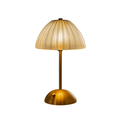 Gold table lamp with a textured shade on a white background

