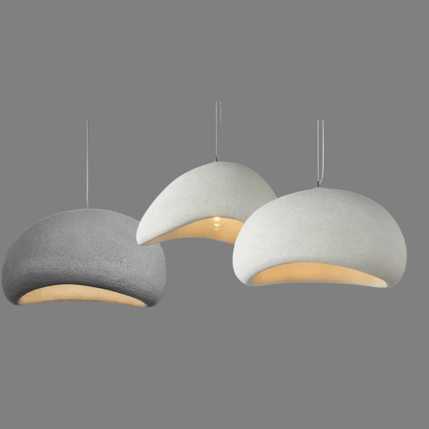 Three gray & White pendant lights on a white background

