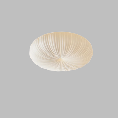 Ceiling light fixture with ribbed design on a beige background