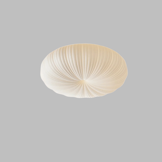 Ceiling light fixture with ribbed design on a beige background