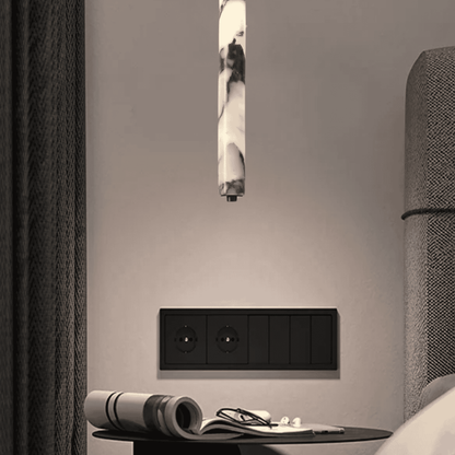 Marble pendant lights above bedside tables hotel bedroom