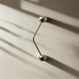 Silver door handles on a beige wall