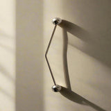 Metallic silver handles on beige backround