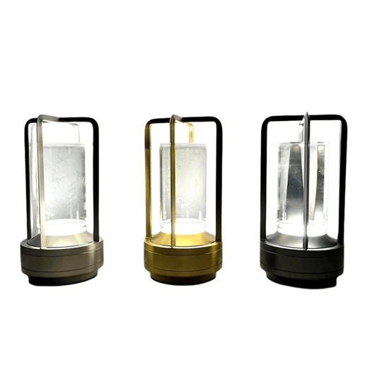 Three portable lanterns with different color finishes on a white background