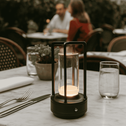 Lantern on a table with people sitting at another table in the background