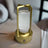 Gold lantern with a clear glass cover on a white background