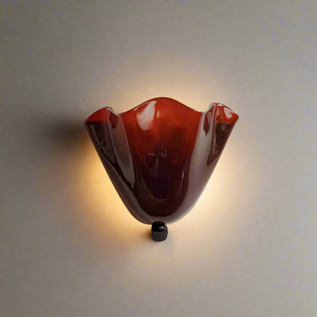 Red decorative light fixture on a beige background