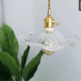 Illuminate your space with the Nordic LED Pendant Light – Colorful Glass, featuring a unique glass design and copper accents.
