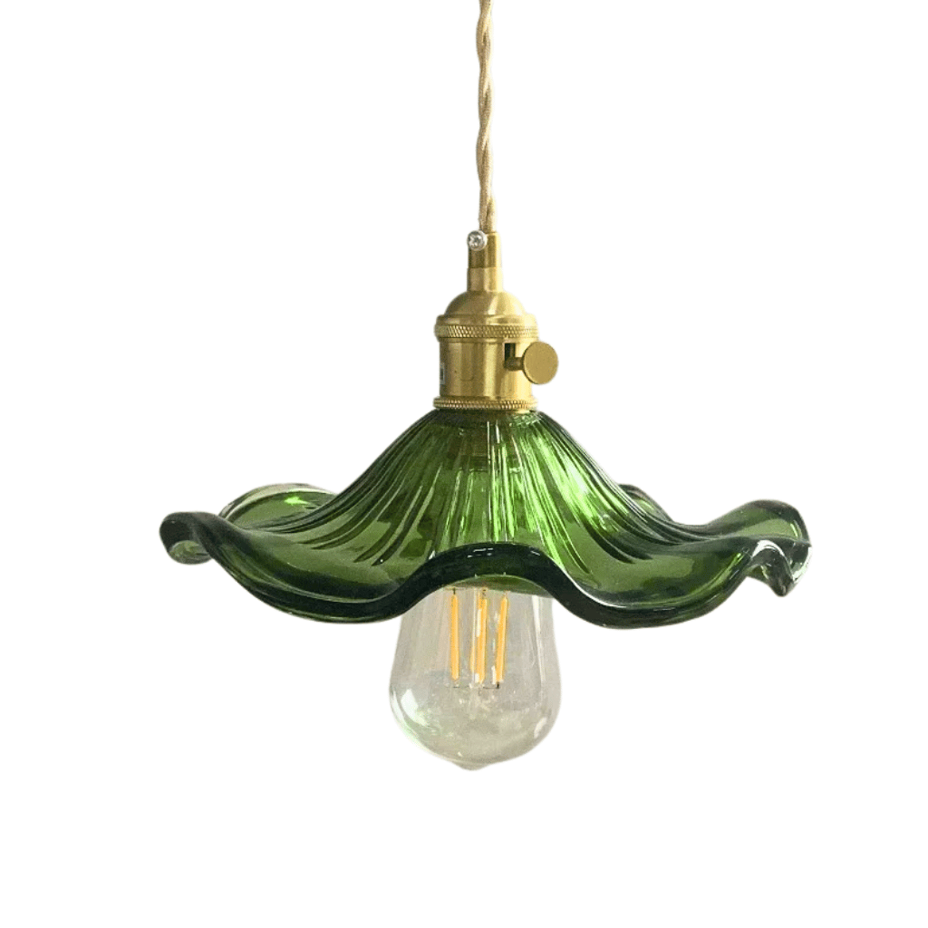 Green pendant light with a brass fixture on a white background