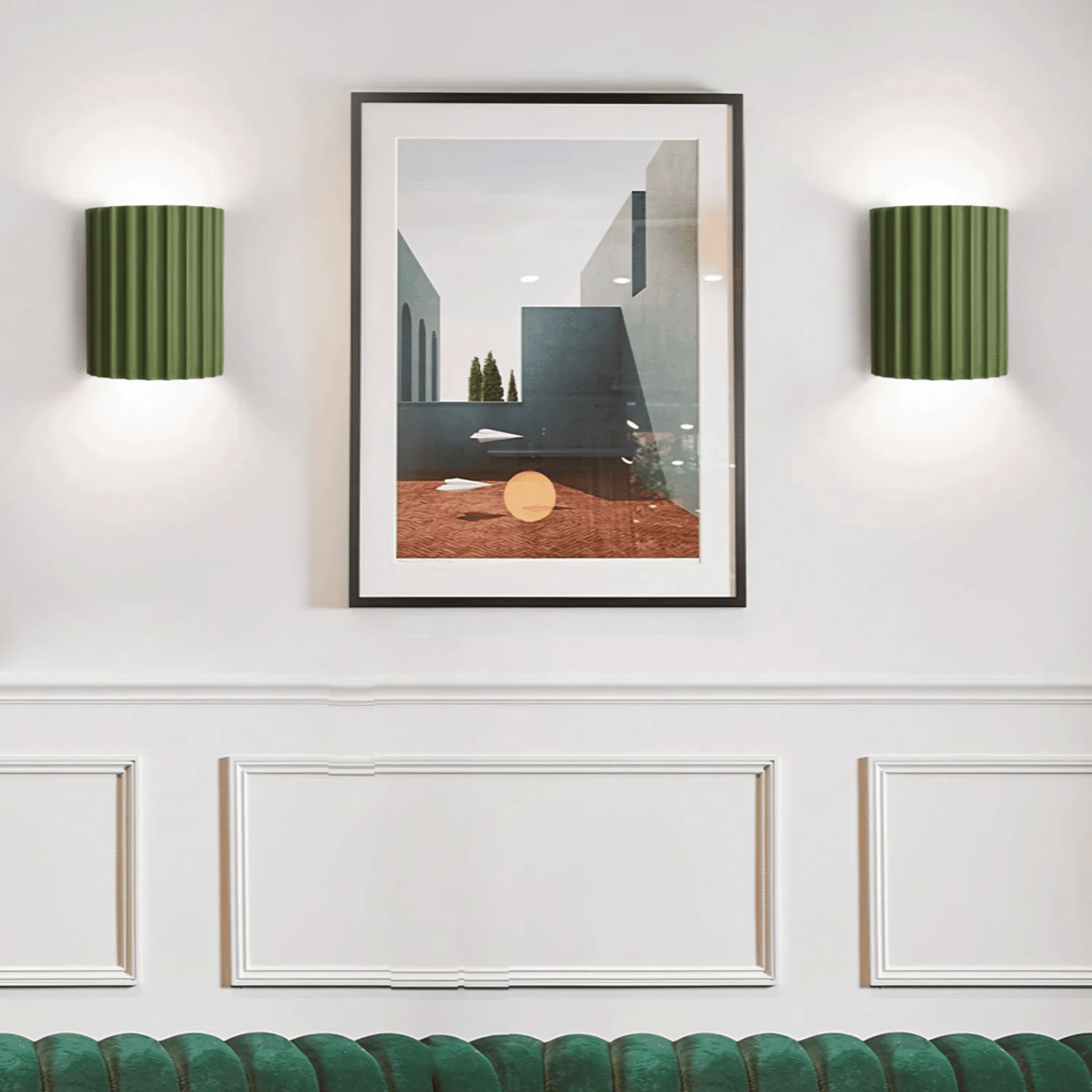 Framed abstract art piece on a wall with two green wall lamps.