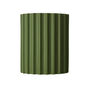 Green corrugated metal panel on a white background