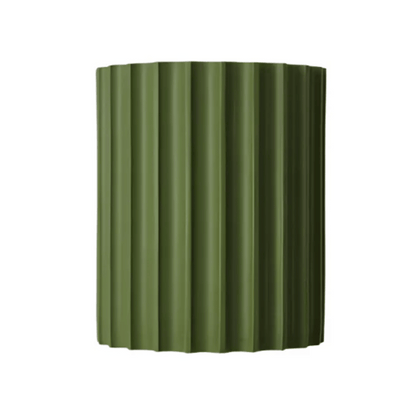 Green corrugated metal panel on a white background