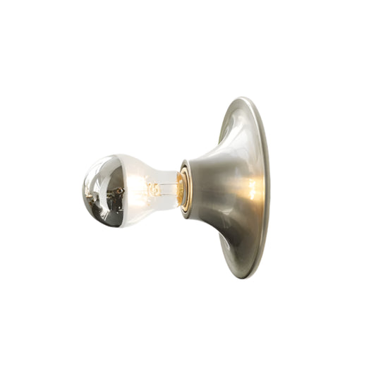 Wall-mounted light fixture with a modern design on a neutral background