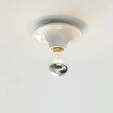 Ceiling light fixture with a glass bulb on a white background