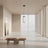 Modern pendant light with cylindrical glass shade on a gray background
