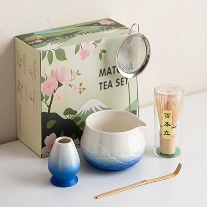 Matcha tea set with a decorative box featuring cherry blossoms and Mount Fuji.