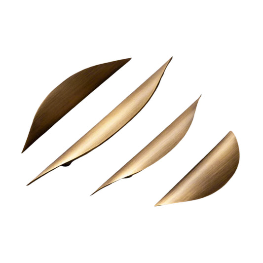 Four gold leaf-shaped objects on a gray background