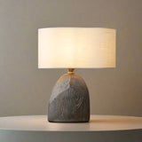 Table lamp with wooden base on a white backround