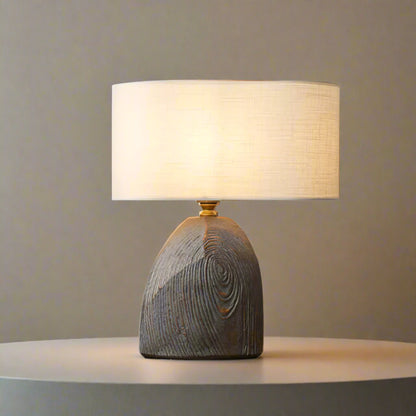 Table lamp with wooden base on a white backround 