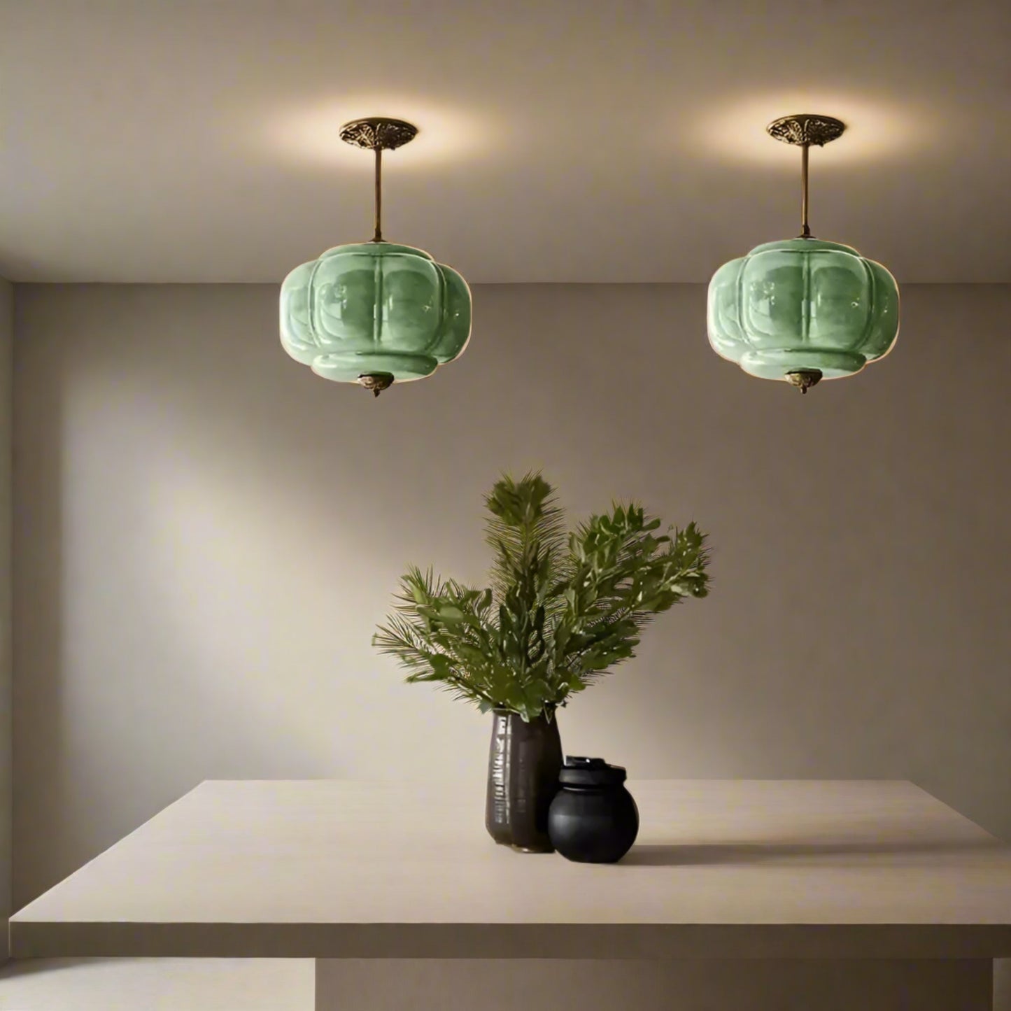 Kitchen with green pendant lights, marble backsplash, and wooden table.