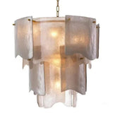 Decorative chandelier with textured glass shades on a white background