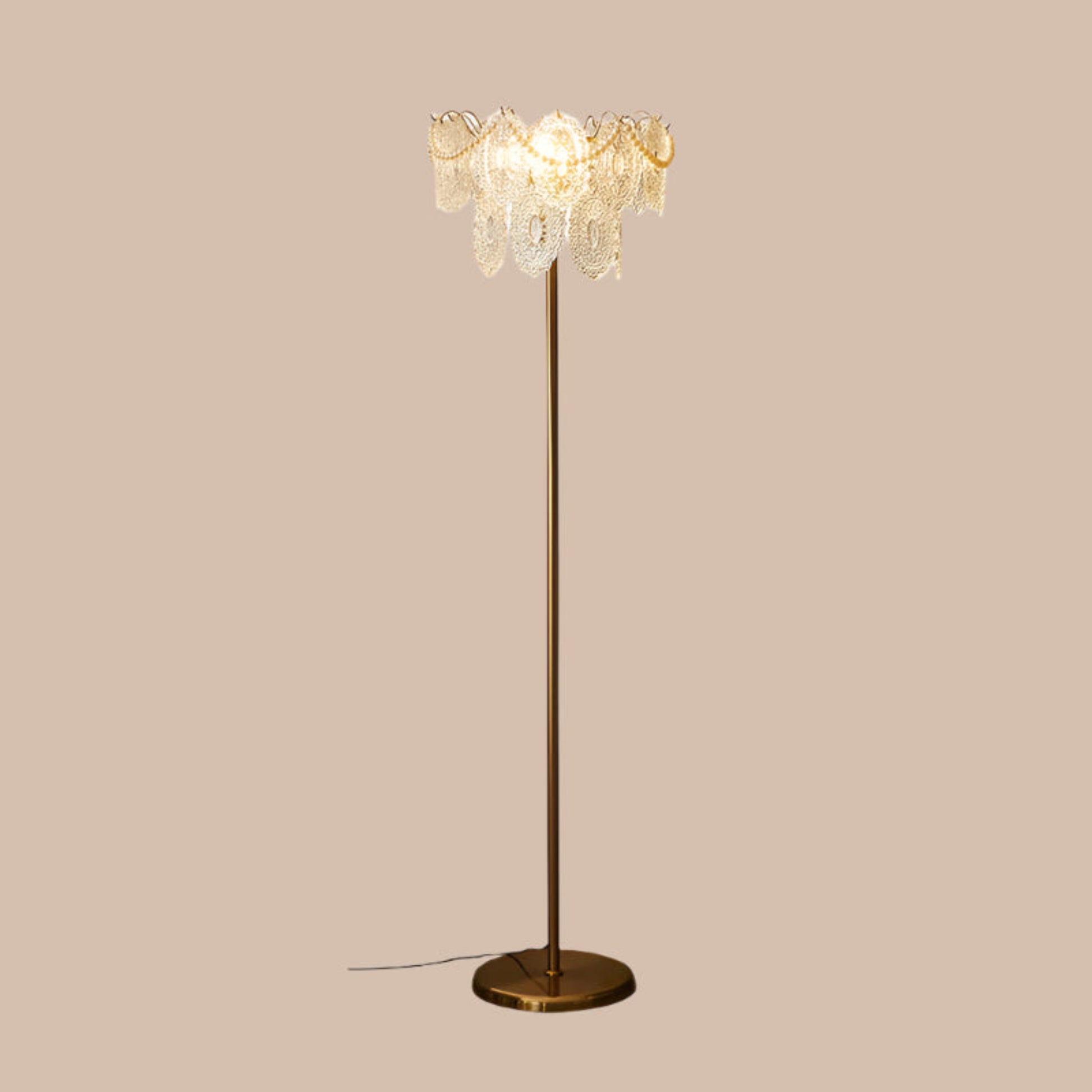 Decorative floor lamp with crystal details on a white background