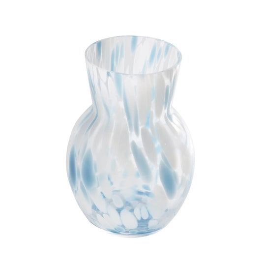 Glass vase with blue and white marbled pattern on a white background