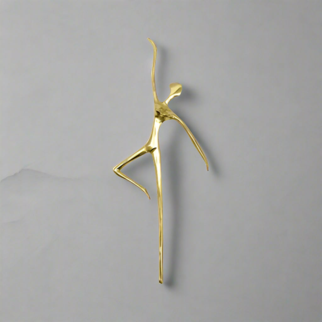 Gold ballet dancer cabinet handle decorative i on a white background
